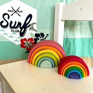 Two Grimm’s wooden rainbow staking toys one small Grimm’s one medium pastel